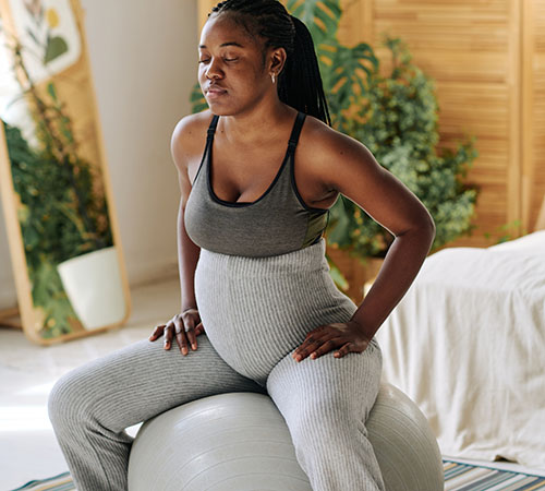 Pregnant couple doing yoga